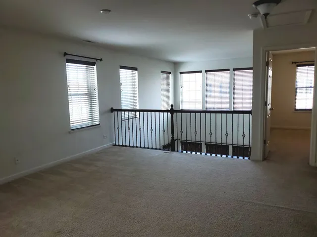 a view of a hallway with staircase