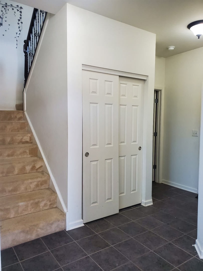 10070 Cummings Street, Unit 3401 Huntley, IL 60142 - Photo 3 of 27 wooden floor with white walls