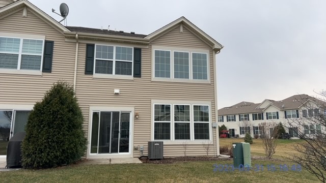 10070 Cummings Street, Unit 3401 Huntley, IL 60142 - Photo 4 of 27 a front view of a house with a yard