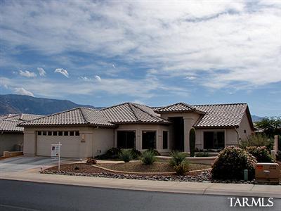 62195 East Northwood Road Tucson, AZ 85739 - Photo 1 of 25 a front view of a house with garden