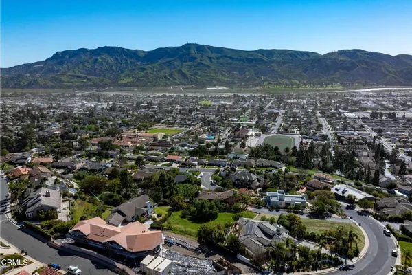 an aerial view of residential house and sandy dunes