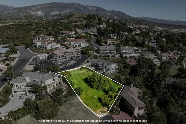 an aerial view of residential house with outdoor space
