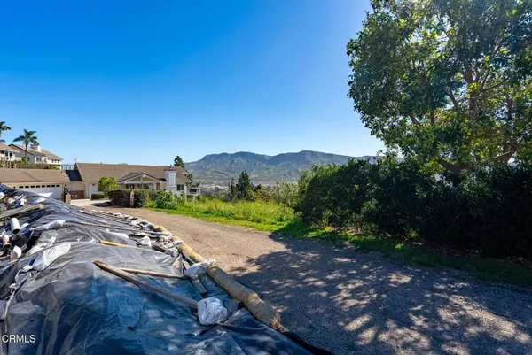 a view of a street with a yard