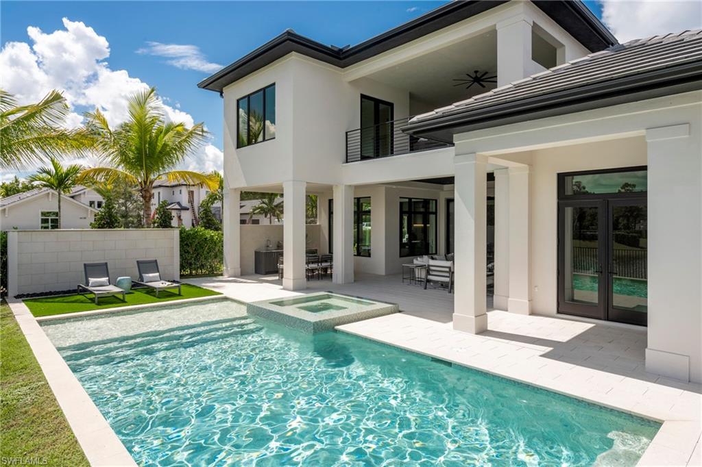 6704 Newport Road Naples, FL 34109 - Photo 39 of 47 a front view of house with yard and outdoor seating