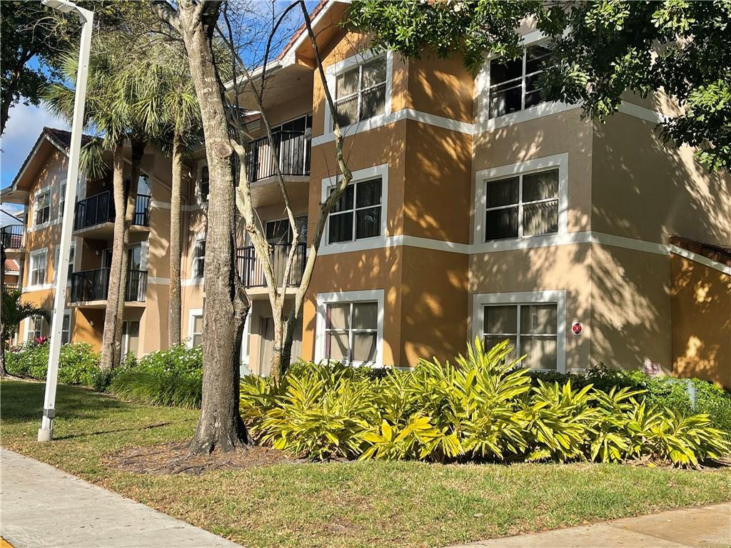 8801 Wiles Road, Unit 207 Coral Springs, FL 33067 - Photo 1 of 31 front view of a building