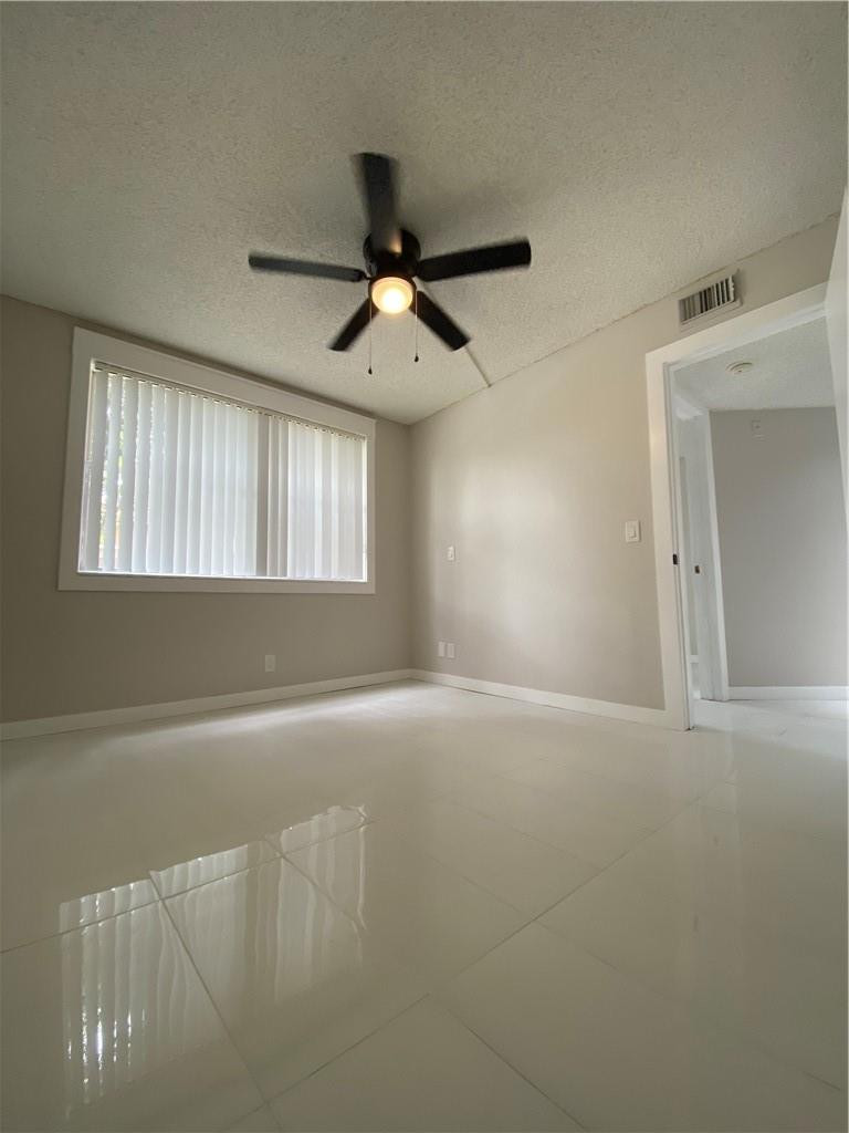 8801 Wiles Road, Unit 207 Coral Springs, FL 33067 - Photo 22 of 31 a view of an empty room and window