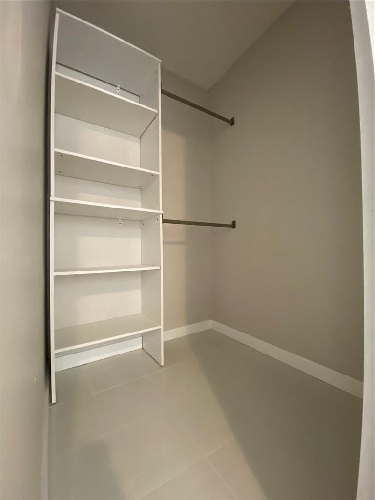8801 Wiles Road, Unit 207 Coral Springs, FL 33067 - Photo 24 of 31 a view of an empty walk in closet