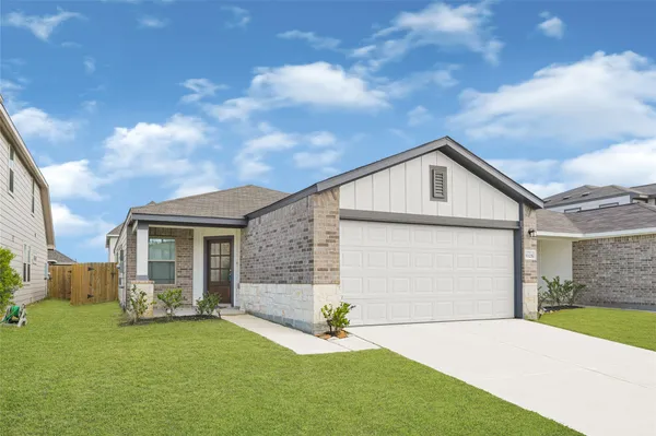 a front view of a house with yard