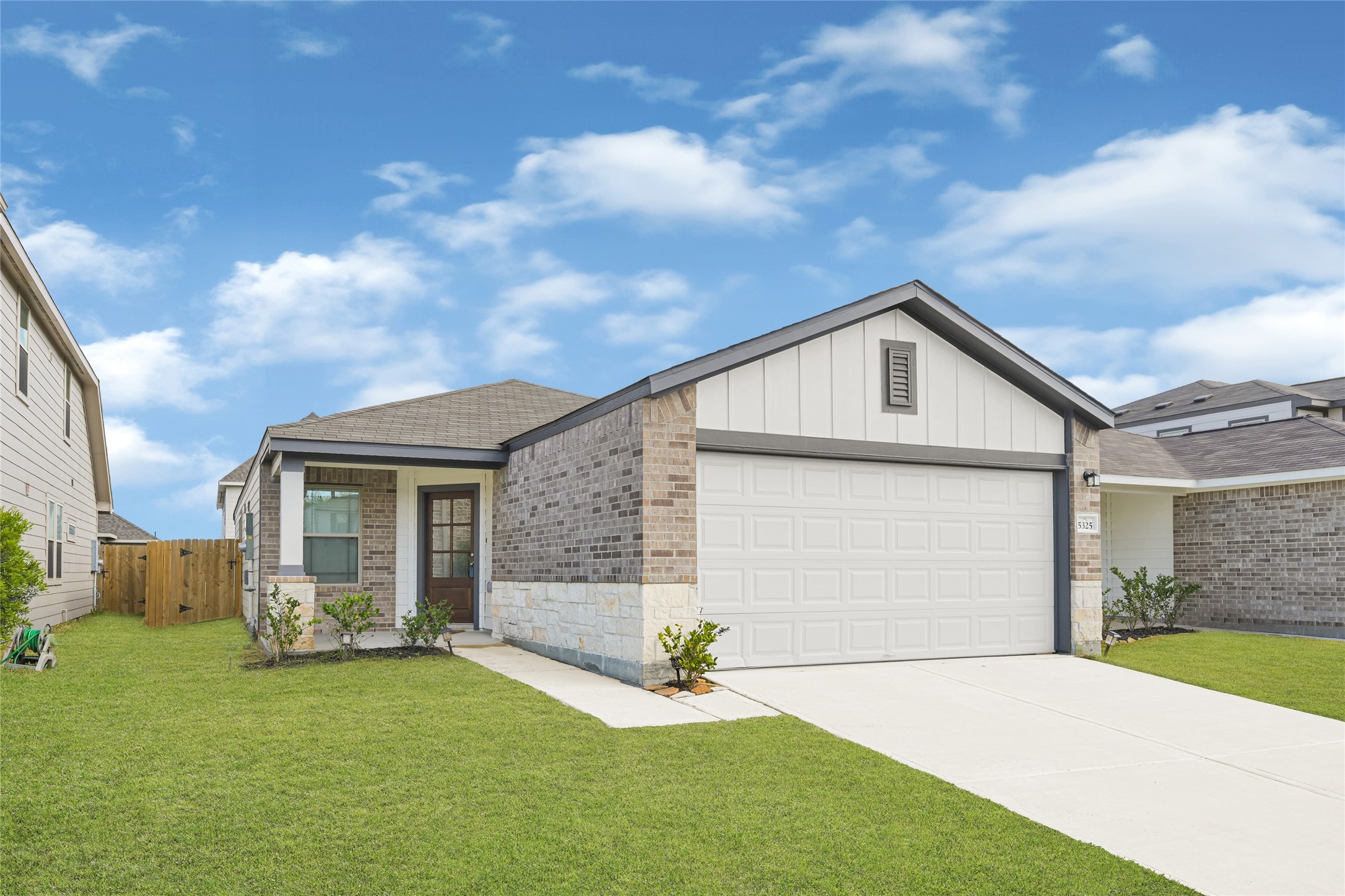a front view of a house with yard