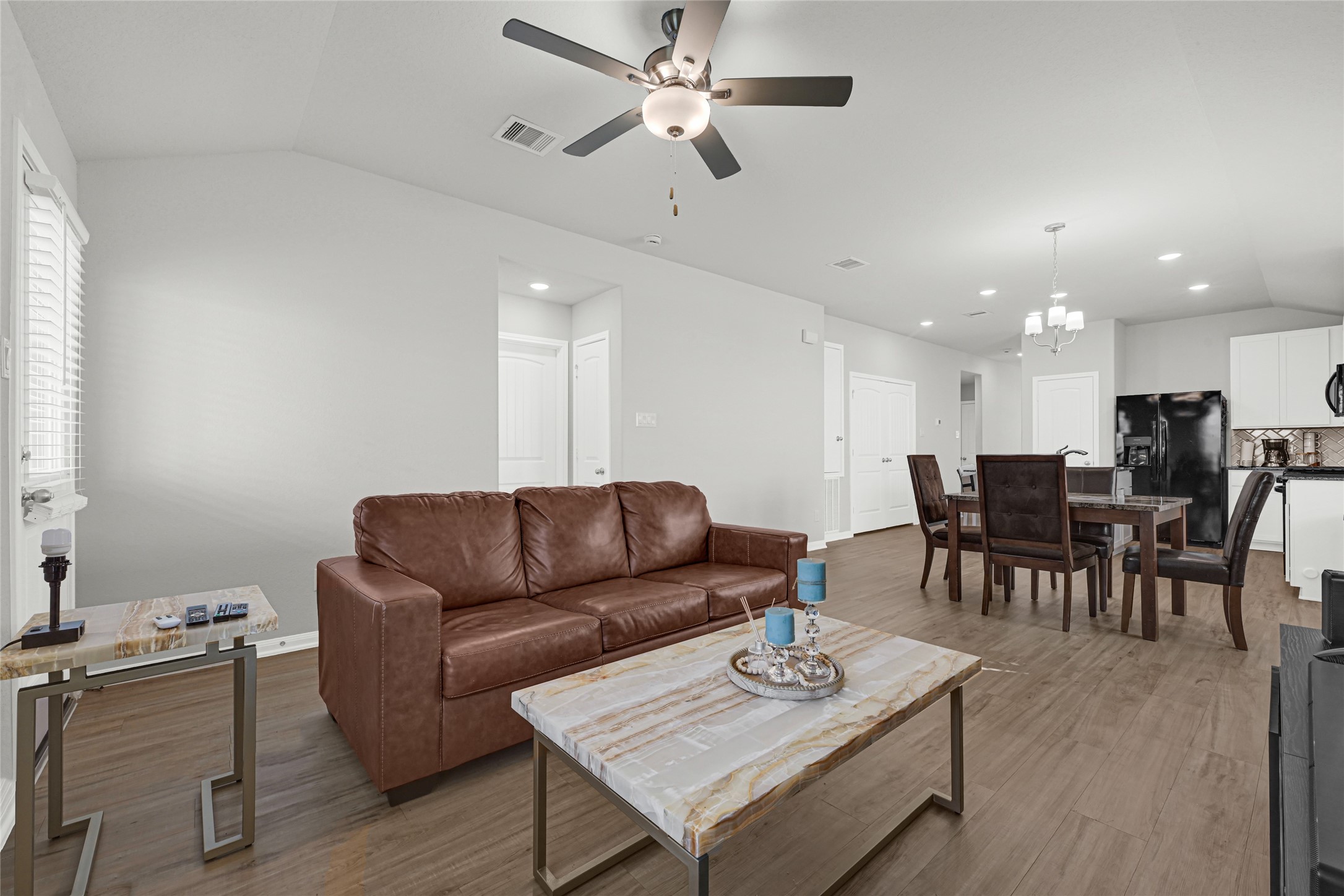 5325 Basquiat Drive Houston, TX 77048 - Photo 11 of 21 a living room with furniture kitchen view and a dining table