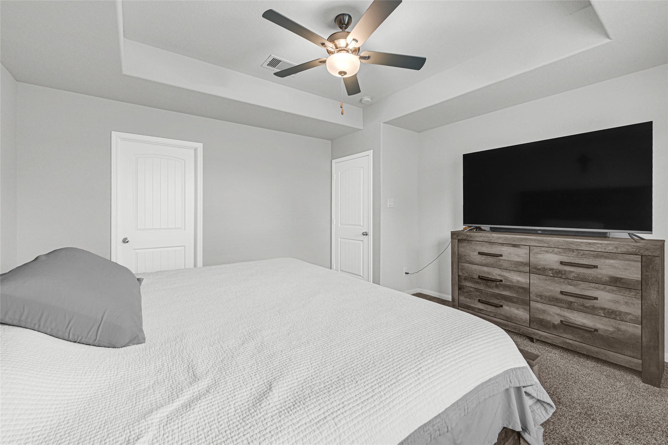 5325 Basquiat Drive Houston, TX 77048 - Photo 13 of 21 a bedroom with a bed and a flat screen tv