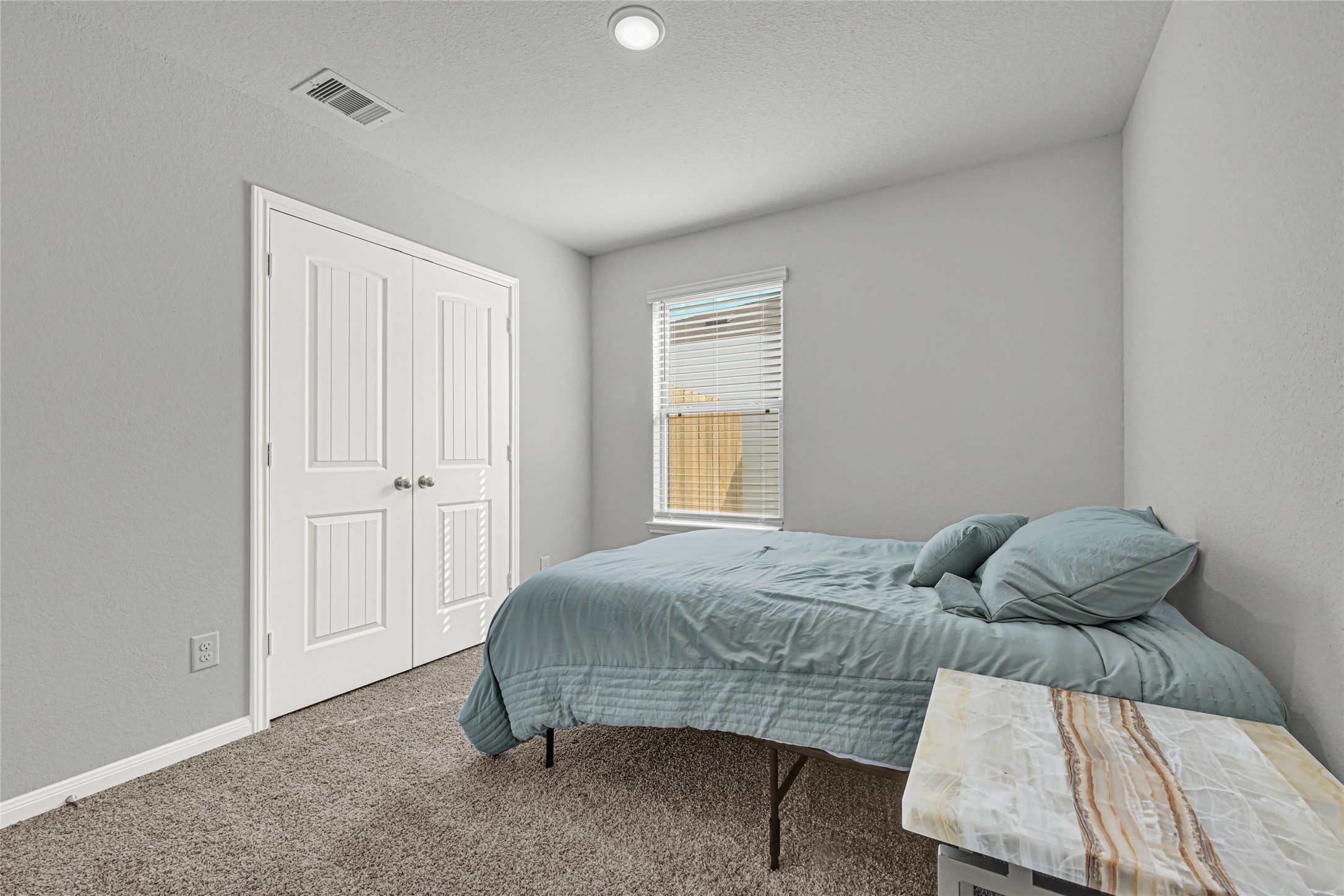 5325 Basquiat Drive Houston, TX 77048 - Photo 17 of 21 a bedroom with a bed and a window