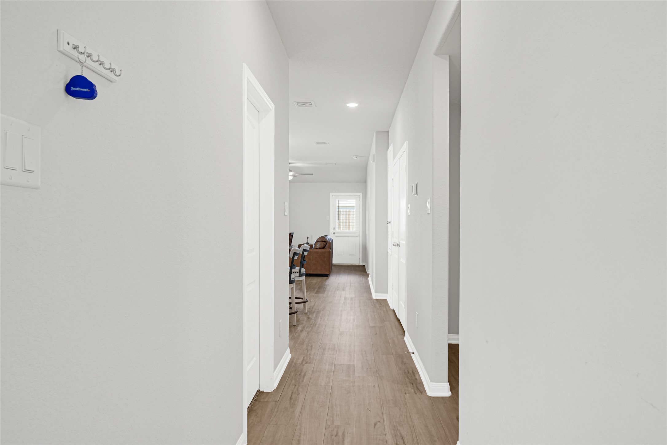 5325 Basquiat Drive Houston, TX 77048 - Photo 4 of 21 a view of a hallway with a wooden floor