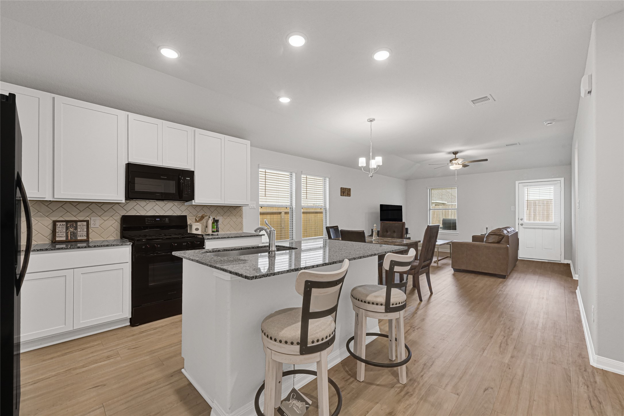 5325 Basquiat Drive Houston, TX 77048 - Photo 6 of 21 a kitchen with a table and chairs in it