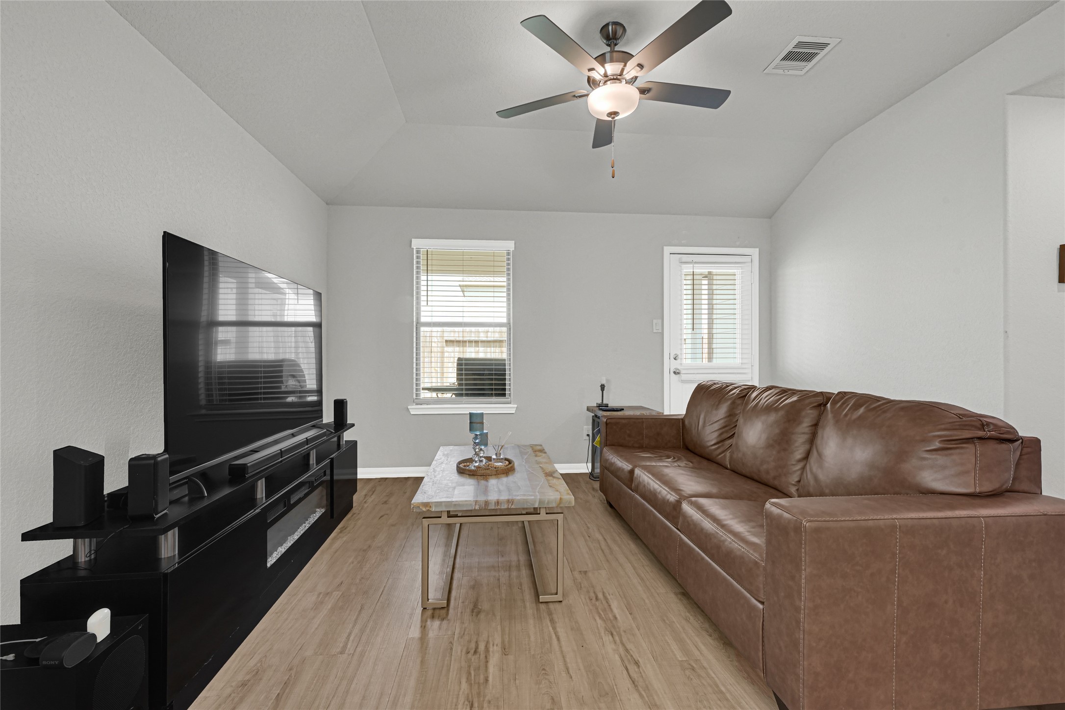 5325 Basquiat Drive Houston, TX 77048 - Photo 10 of 21 a living room with furniture and a flat screen tv