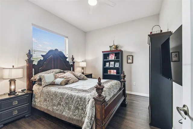 a bed room with a bed and a book shelf