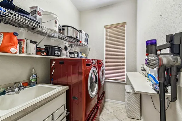 a view of an outdoor dining space with furniture and window
