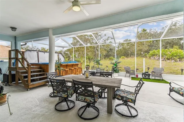 a view of a chairs and tables in a patio