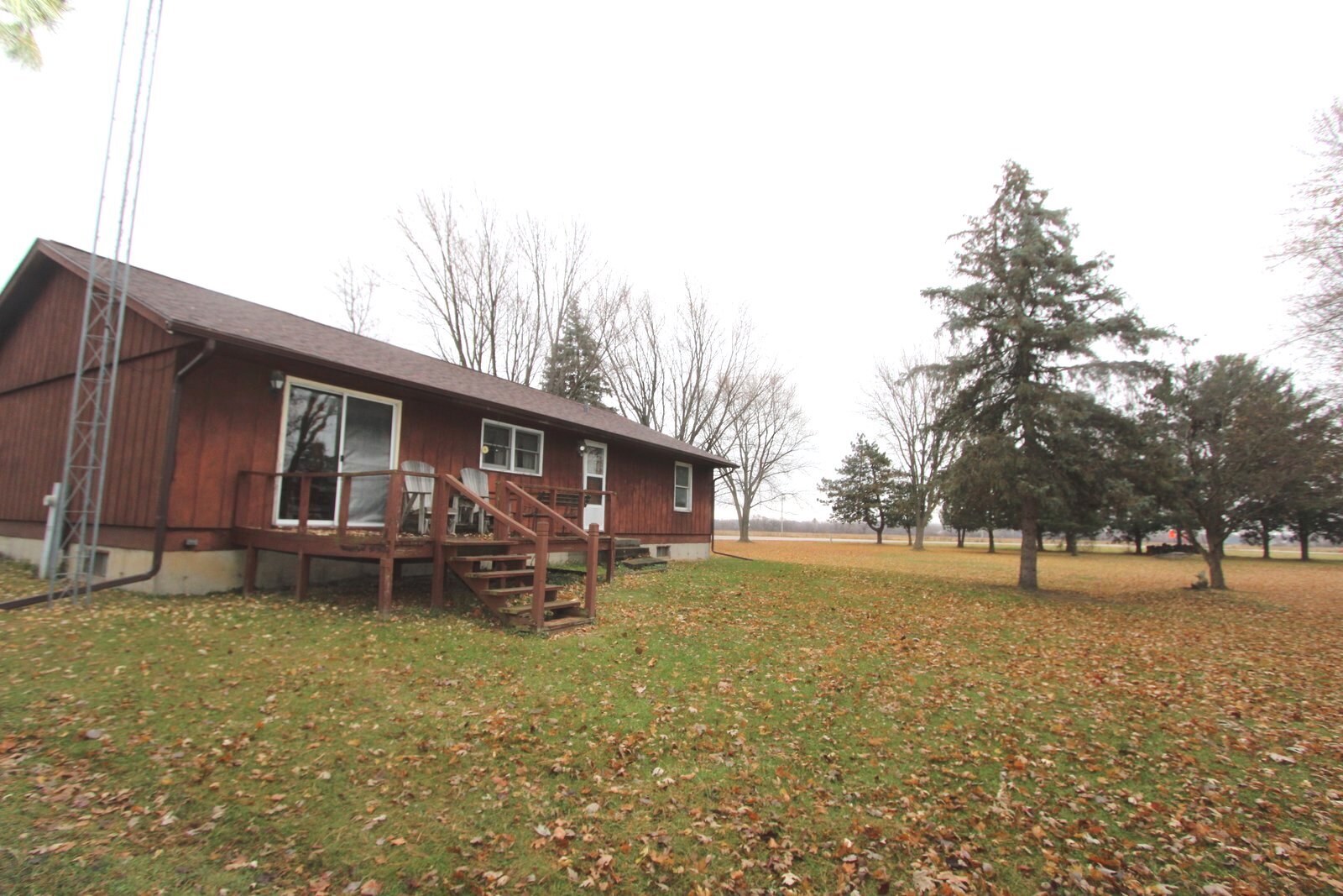 8105 Lawrence Road Harvard, IL 60033 - Photo 13 of 14 a backyard of a house with barbeque oven table and chairs