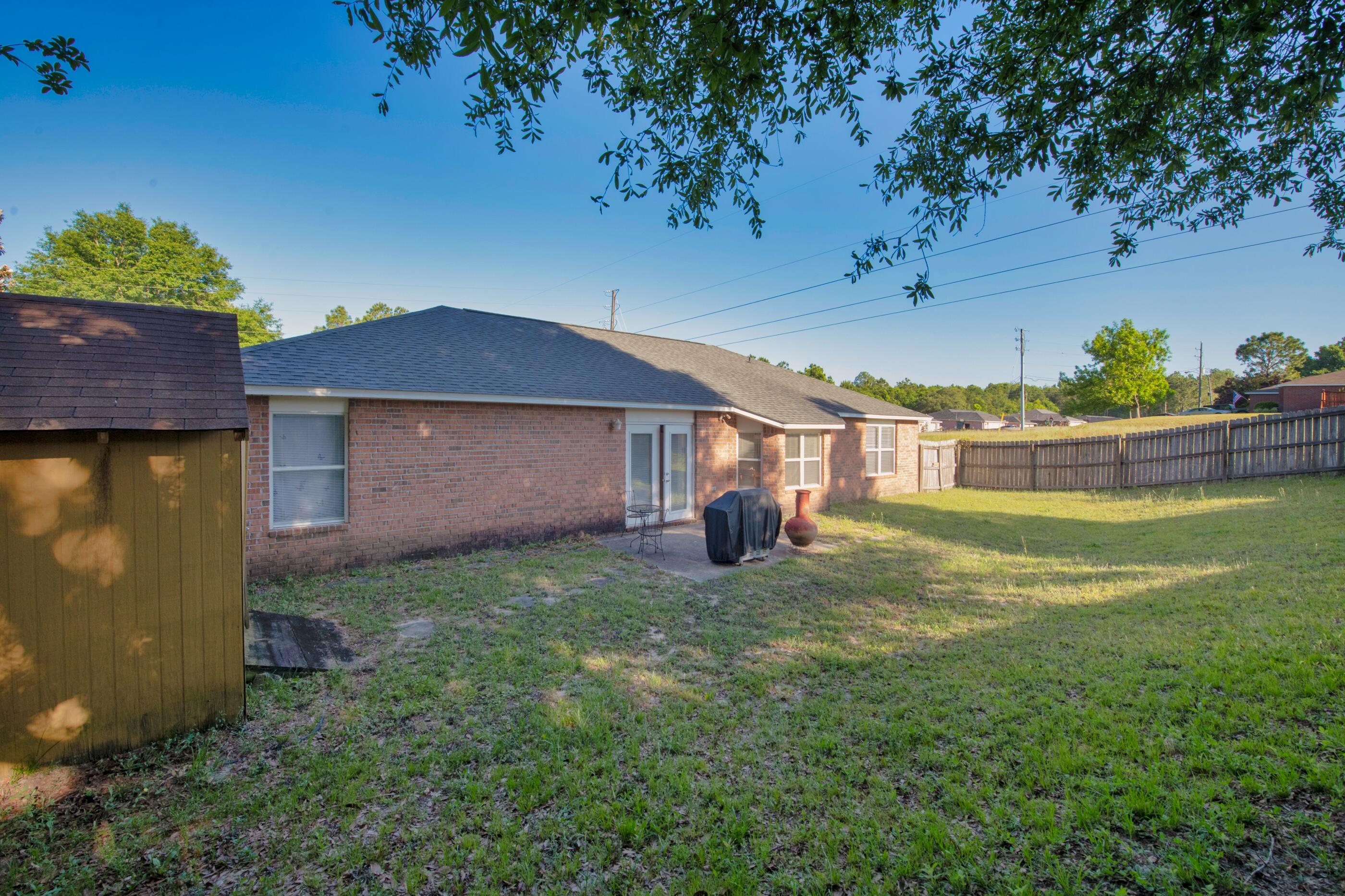 220 Riverchase Boulevard Crestview, FL 32536 - Photo 21 of 24 a view of a house with a yard
