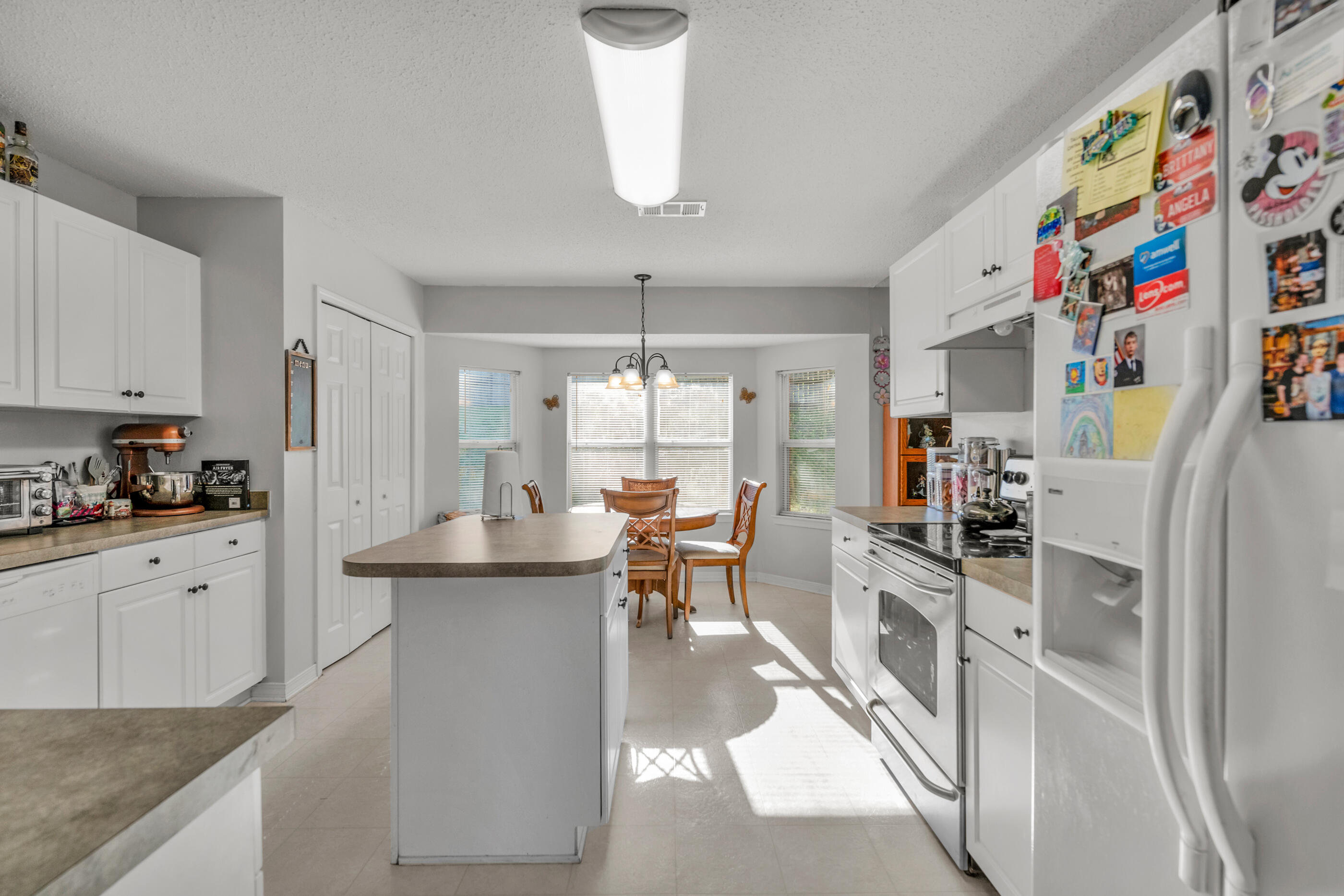 220 Riverchase Boulevard Crestview, FL 32536 - Photo 3 of 24 a kitchen with stainless steel appliances granite countertop a sink stove and cabinets
