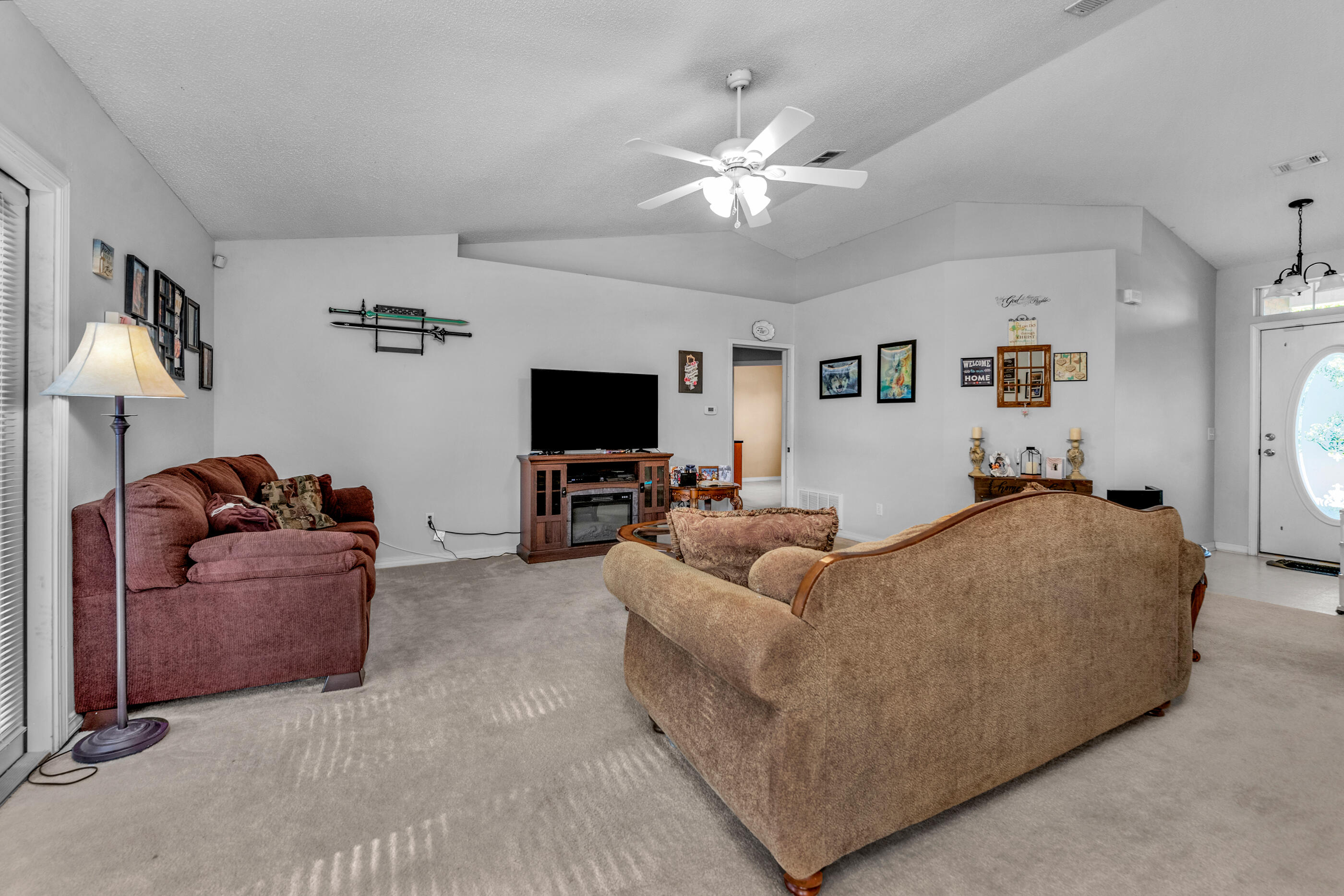 220 Riverchase Boulevard Crestview, FL 32536 - Photo 5 of 24 a living room with furniture and a flat screen tv