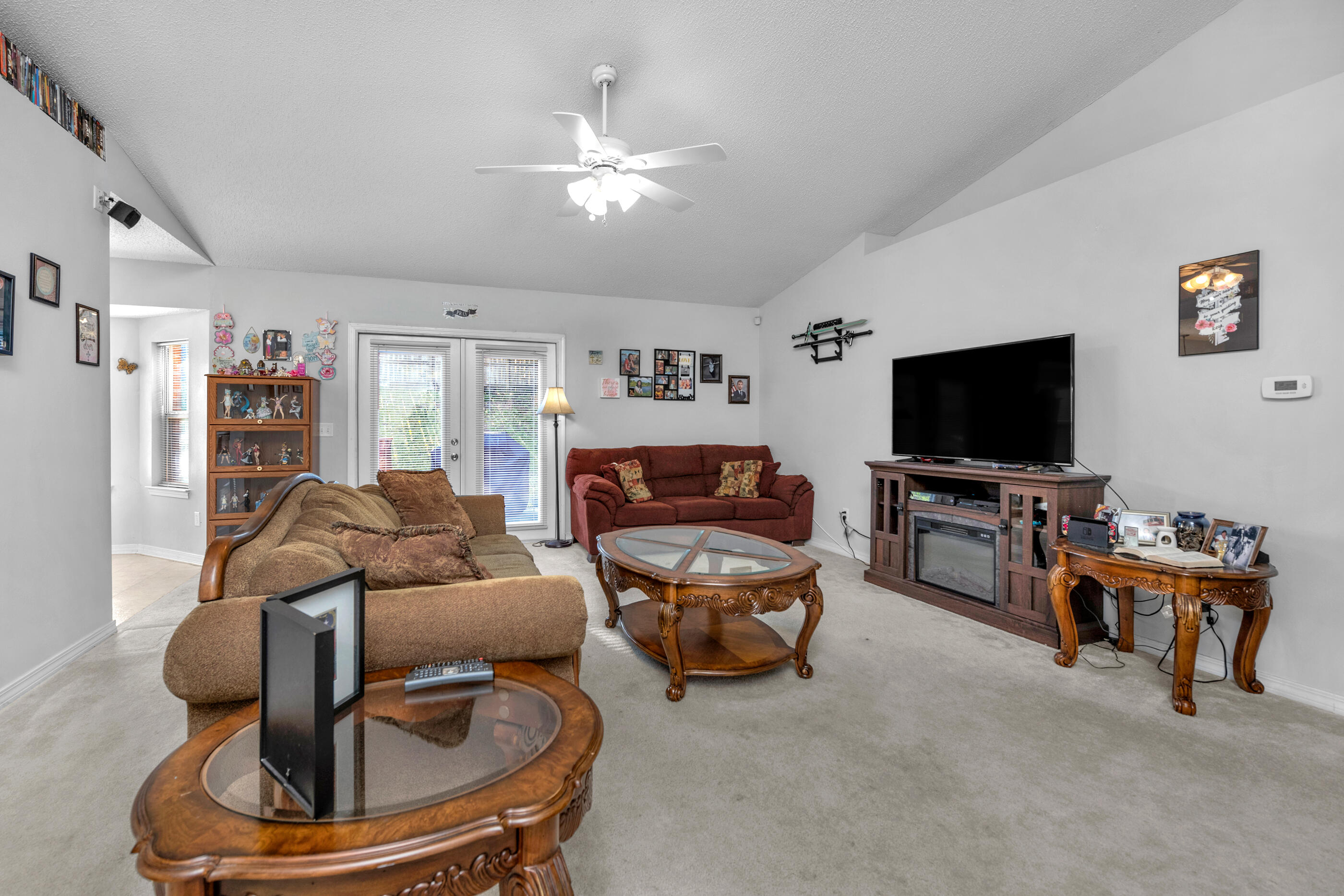 220 Riverchase Boulevard Crestview, FL 32536 - Photo 6 of 24 a living room with furniture and a flat screen tv
