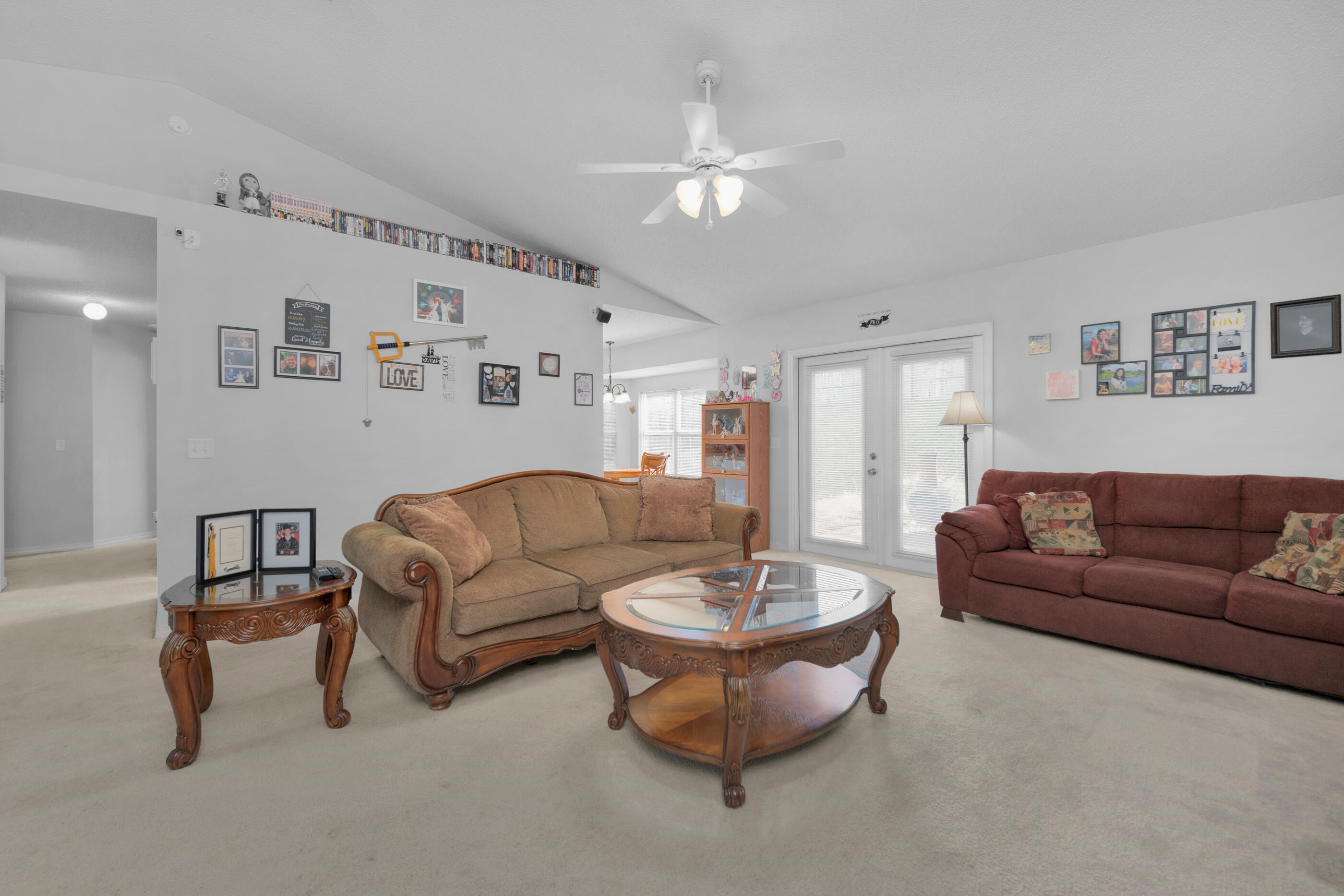 220 Riverchase Boulevard Crestview, FL 32536 - Photo 7 of 24 a living room with furniture and a chandelier