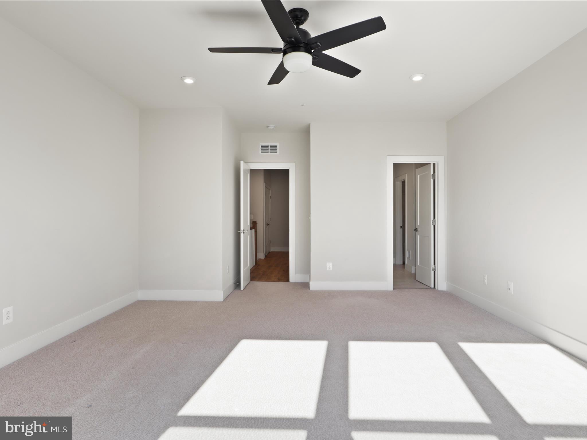 1696 Bandit Loop Reston, VA 20190 - Photo 11 of 38 a view of a hallway with a ceiling fan