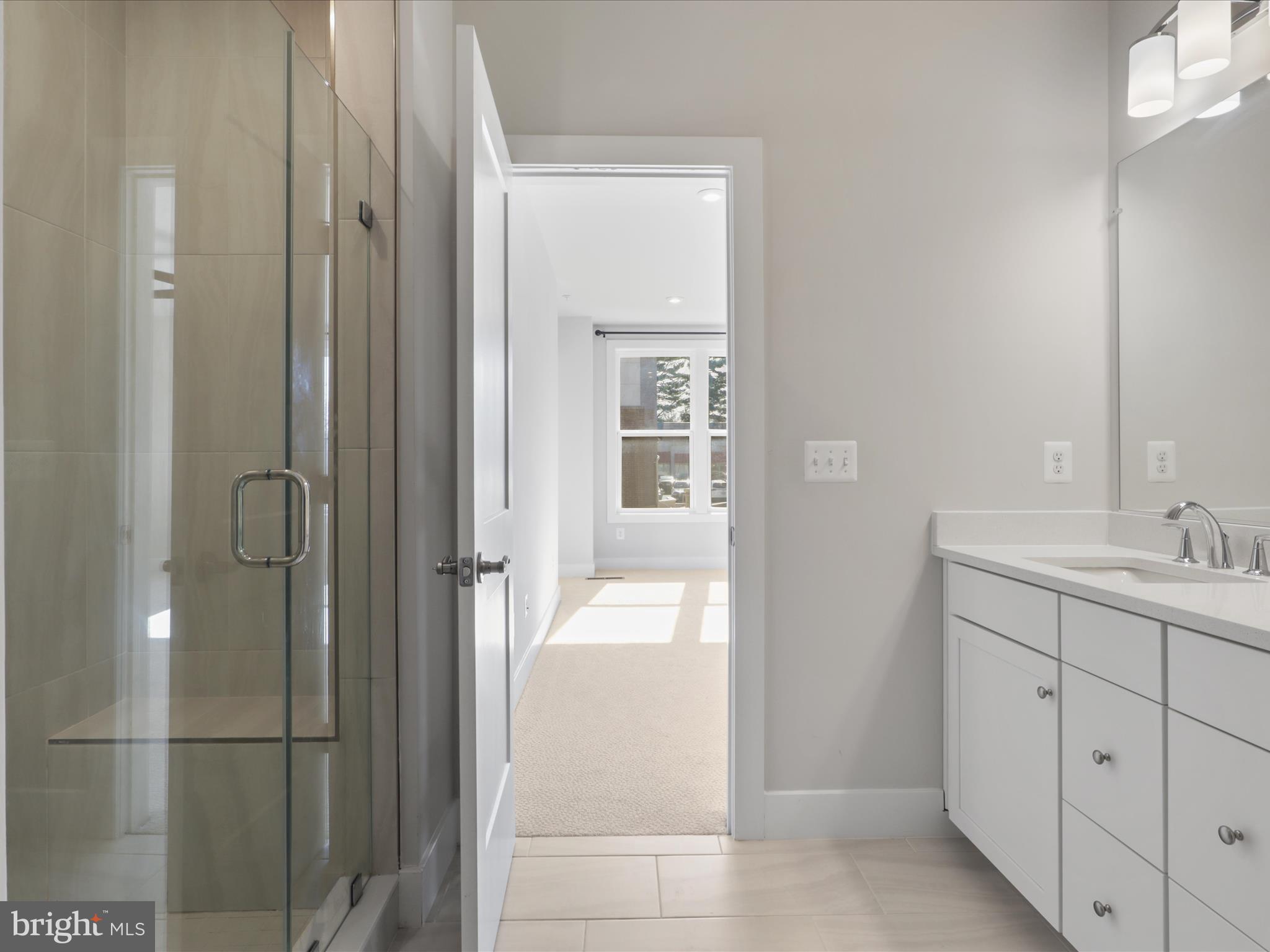 1696 Bandit Loop Reston, VA 20190 - Photo 13 of 38 a bathroom with a sink and mirror