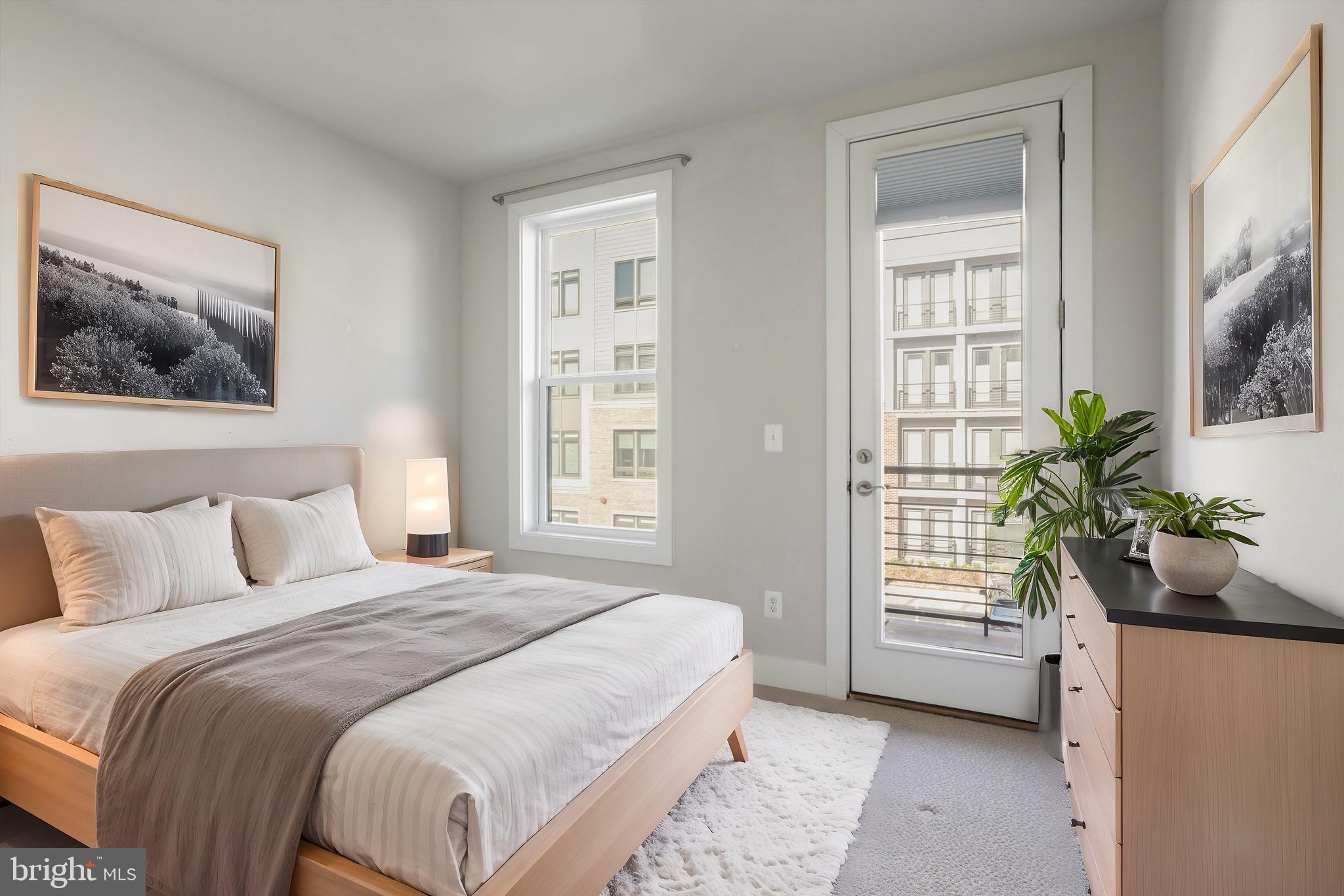 1696 Bandit Loop Reston, VA 20190 - Photo 18 of 38 a bedroom with a bed and a window