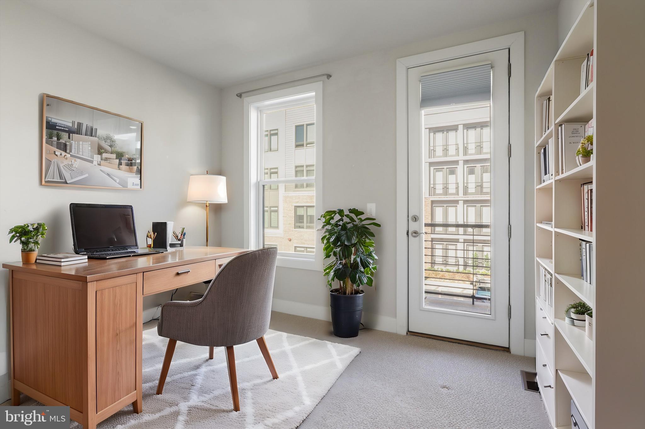 1696 Bandit Loop Reston, VA 20190 - Photo 19 of 38 a workspace with furniture and a window