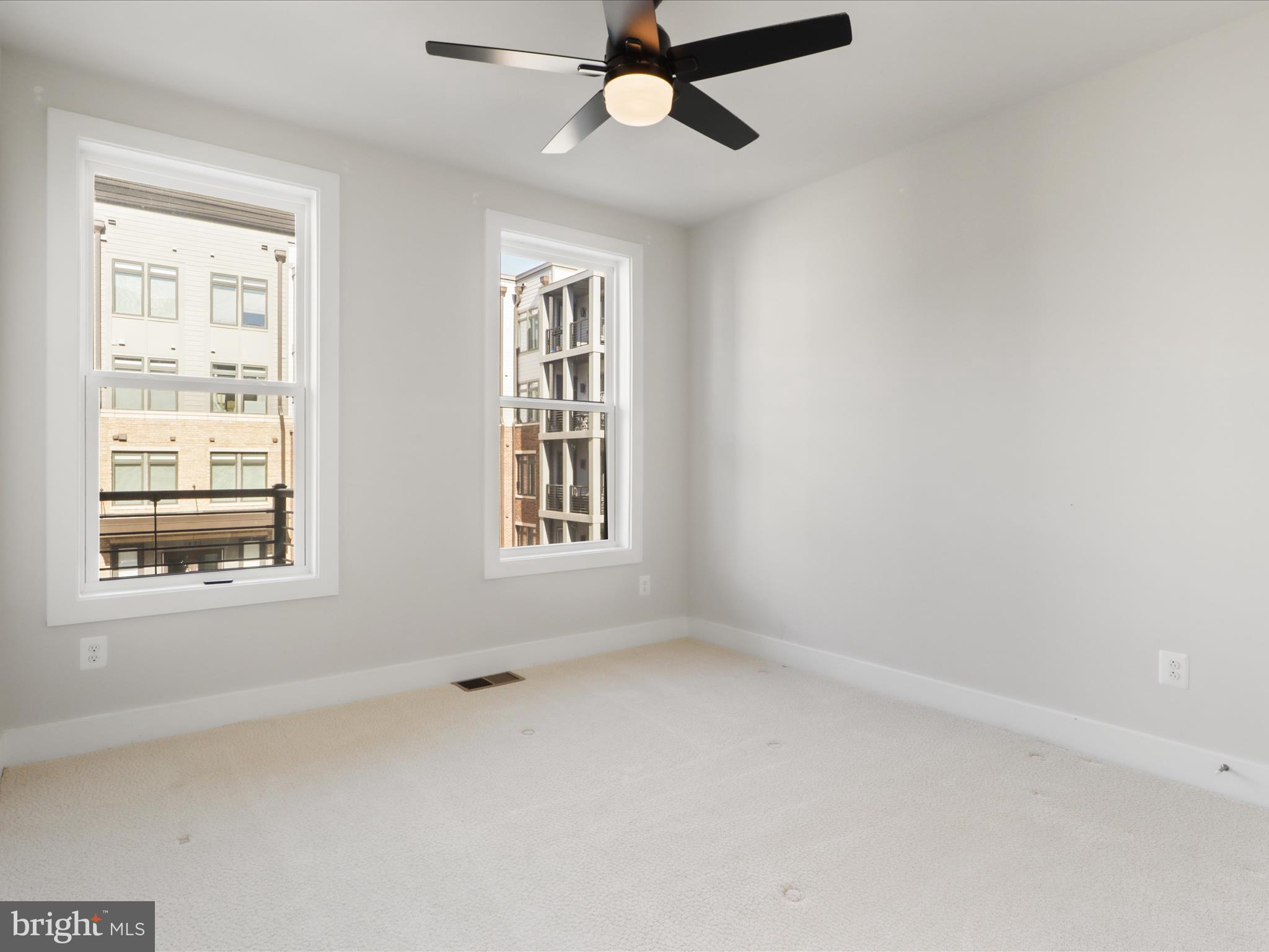 1696 Bandit Loop Reston, VA 20190 - Photo 21 of 38 an empty room with a window and a fan