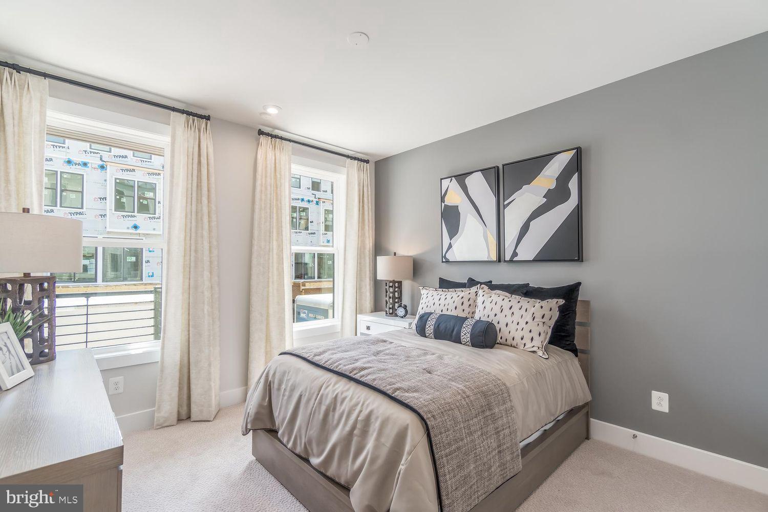 1696 Bandit Loop Reston, VA 20190 - Photo 22 of 38 a bedroom with a large bed and a window