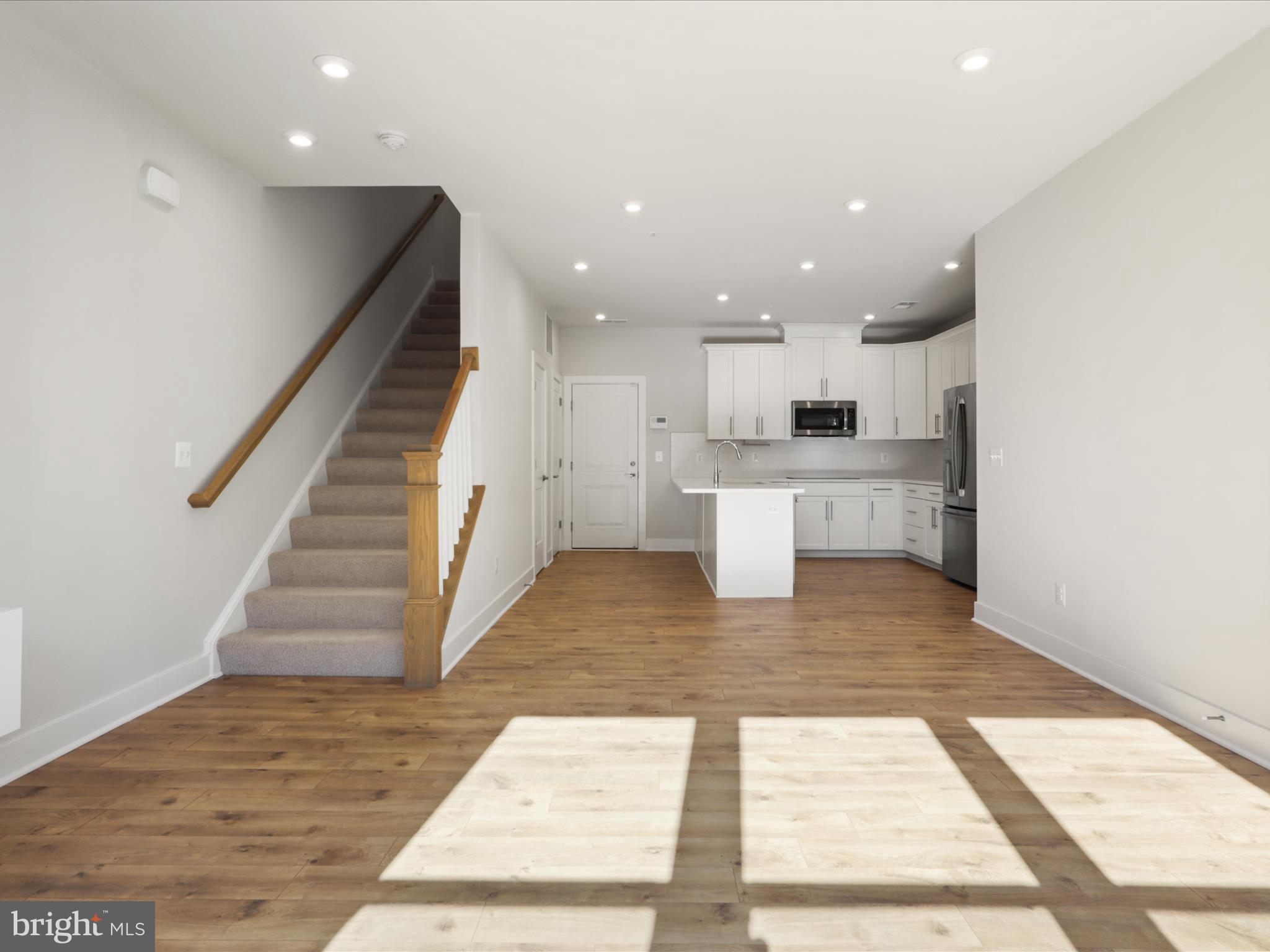 1696 Bandit Loop Reston, VA 20190 - Photo 3 of 38 a view of kitchen with wooden floor and electronic appliances