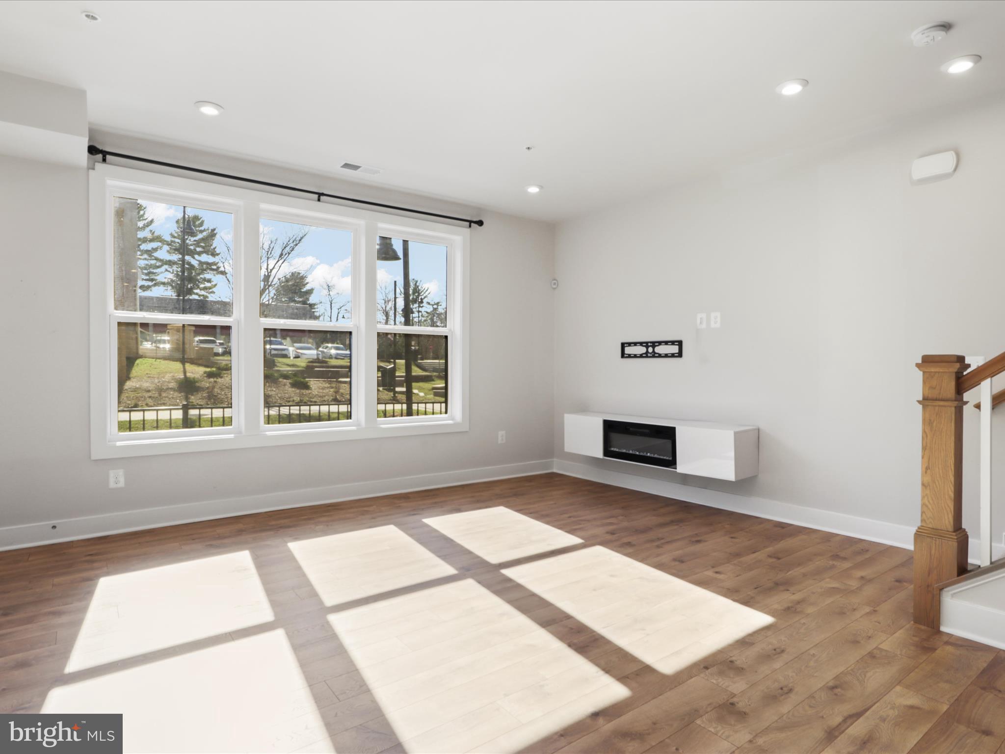 1696 Bandit Loop Reston, VA 20190 - Photo 4 of 38 a view of an empty room with a window