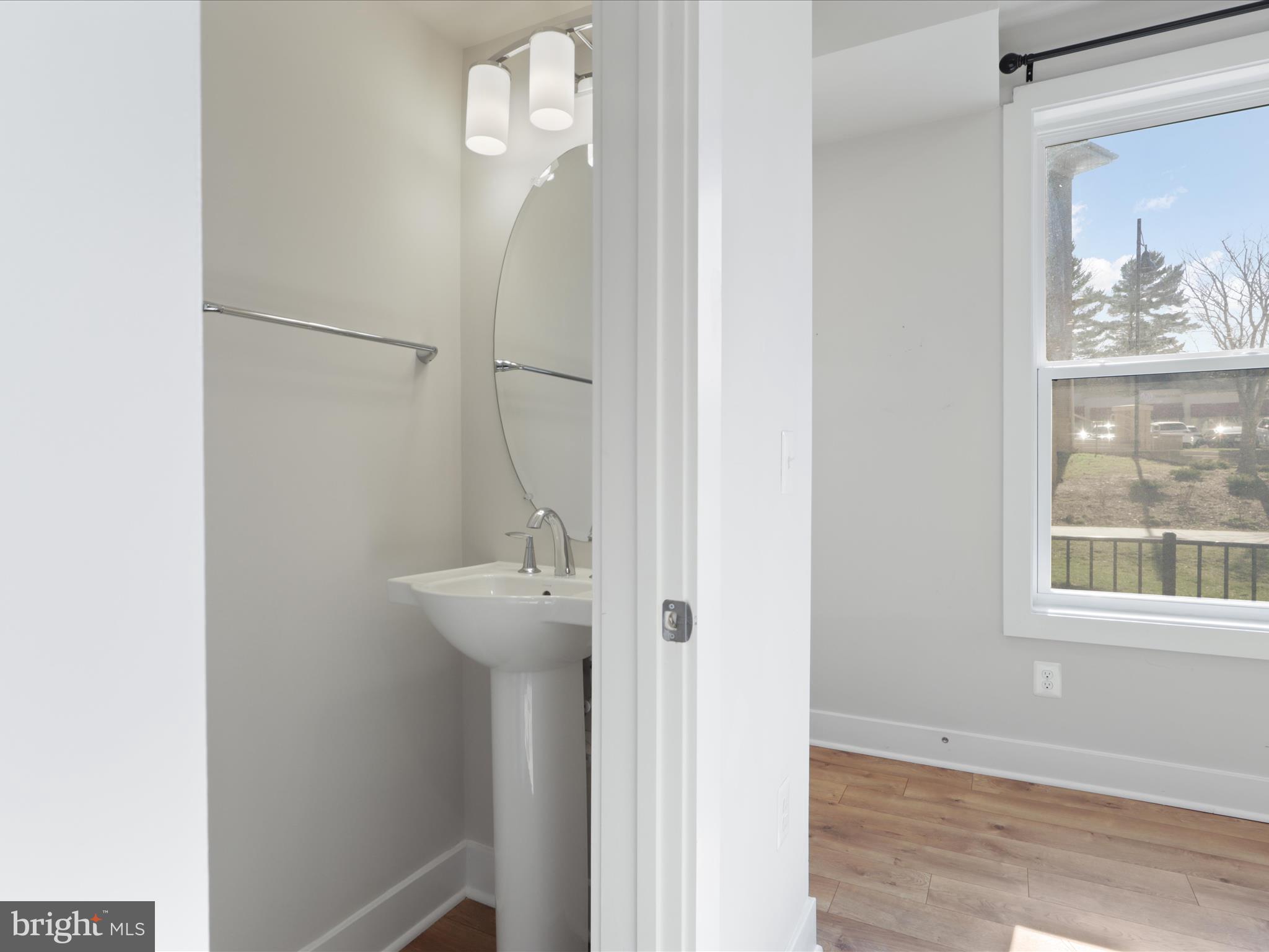 1696 Bandit Loop Reston, VA 20190 - Photo 6 of 38 a bathroom with a sink and a mirror