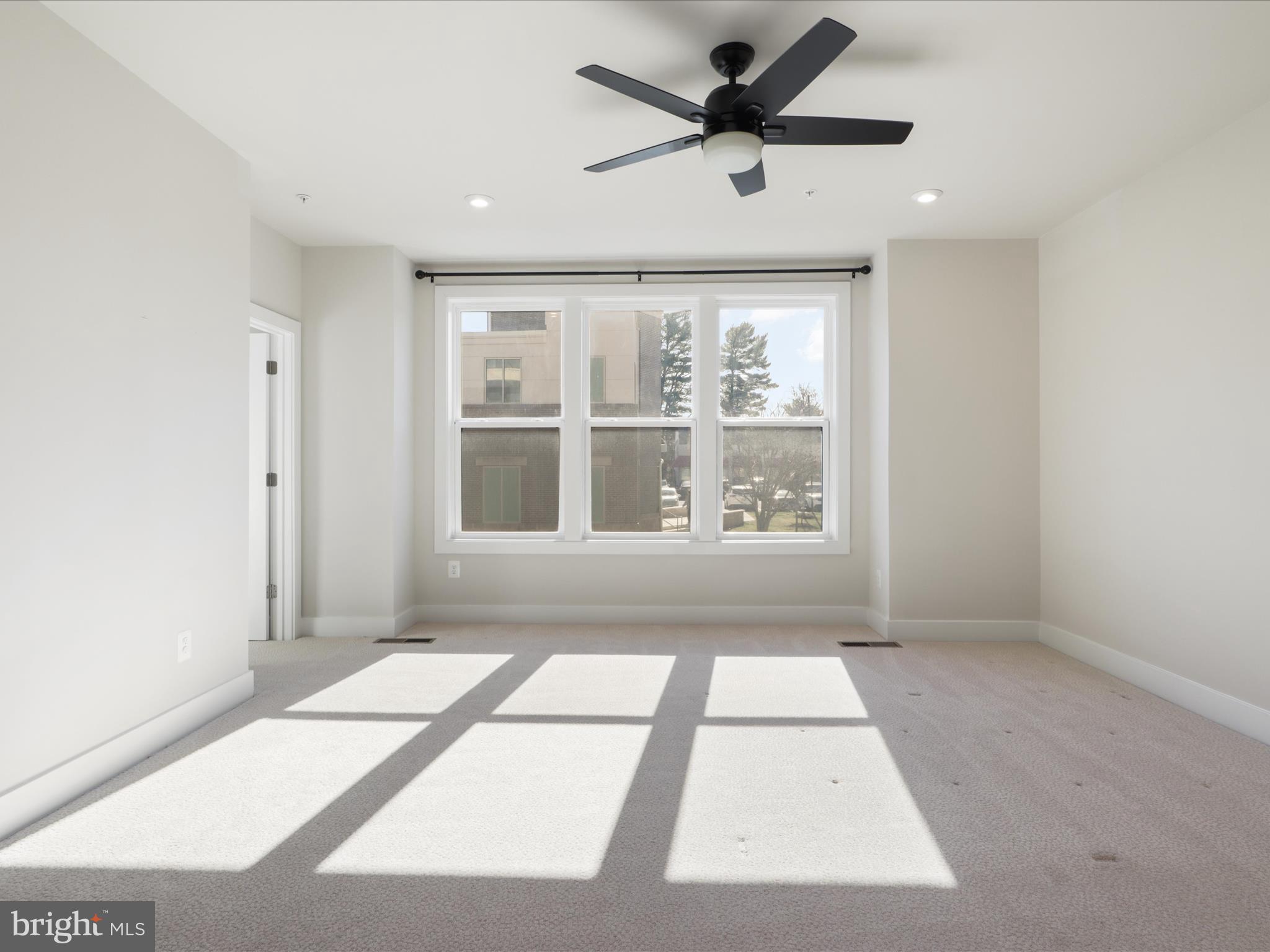 1696 Bandit Loop Reston, VA 20190 - Photo 9 of 38 a view of an empty room with a window