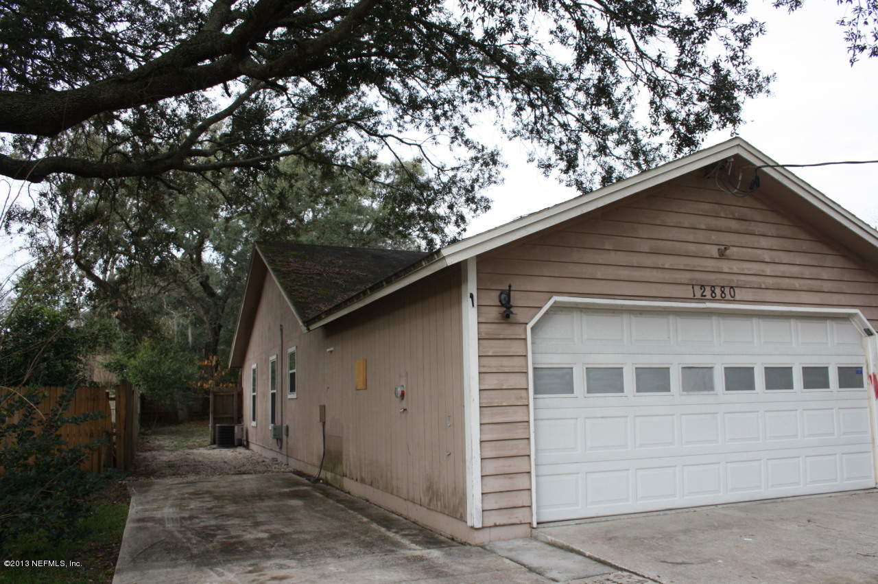 12880 Beaubien Road Jacksonville, FL 32258 - Photo 19 of 20 a view of a house with a tree