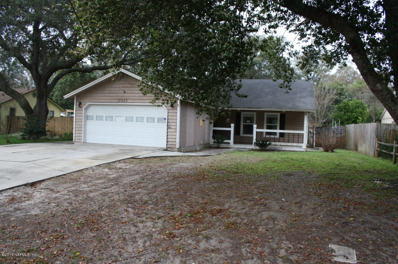12880 Beaubien Road Jacksonville, FL 32258 - Photo 20 of 20 a front view of a house with a yard and garage