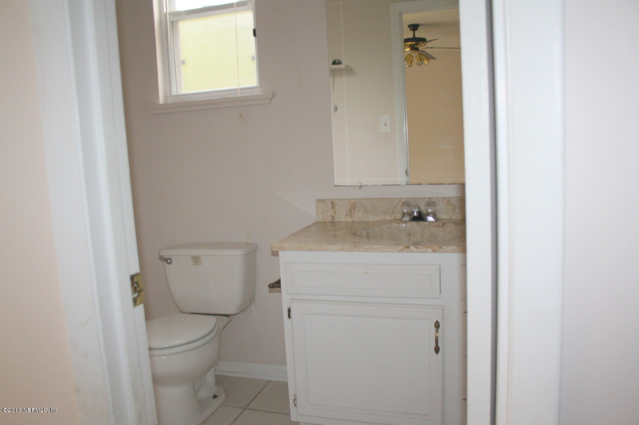 12880 Beaubien Road Jacksonville, FL 32258 - Photo 10 of 20 a bathroom with a sink toilet and vanity
