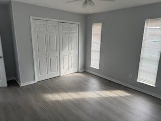 311 Elm Street Portland, TX 78374 - Photo 18 of 26 an empty room with wooden floor and windows