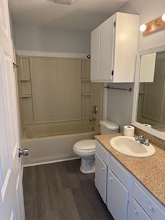 311 Elm Street Portland, TX 78374 - Photo 19 of 26 a bathroom with a granite countertop sink toilet a mirror and shower