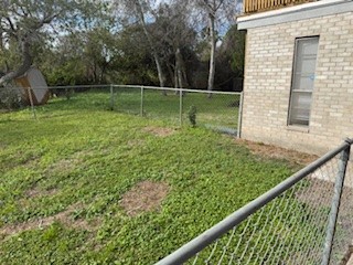 311 Elm Street Portland, TX 78374 - Photo 24 of 26 a view of a backyard