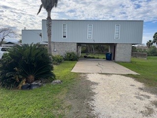 311 Elm Street Portland, TX 78374 - Photo 4 of 26 a backyard of a house with lots of green space