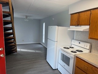 311 Elm Street Portland, TX 78374 - Photo 5 of 26 a kitchen with a refrigerator and a stove top oven
