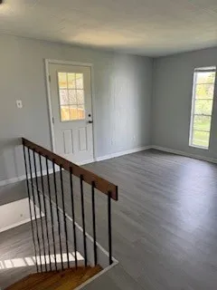 a view of entryway with wooden floor