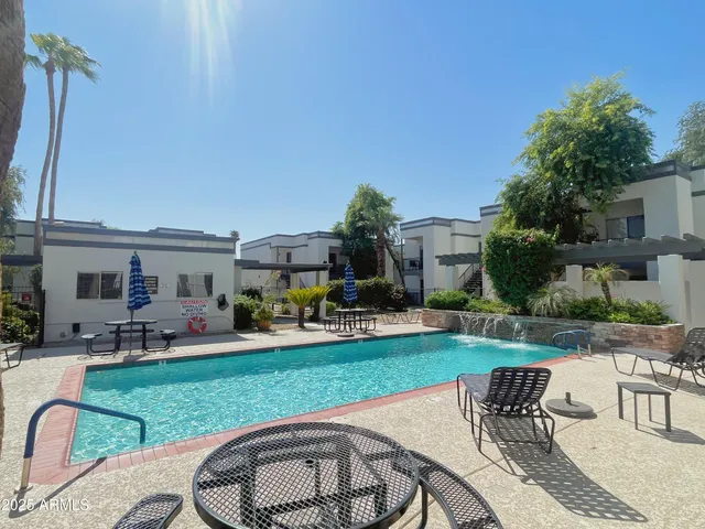 a view of a backyard with sitting area and furniture
