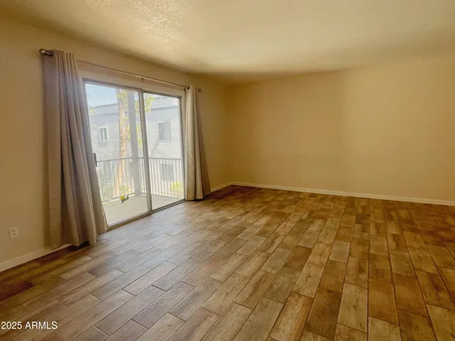 a view of an empty room and window