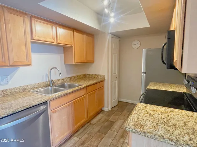 a bedroom with a sink and a mirror